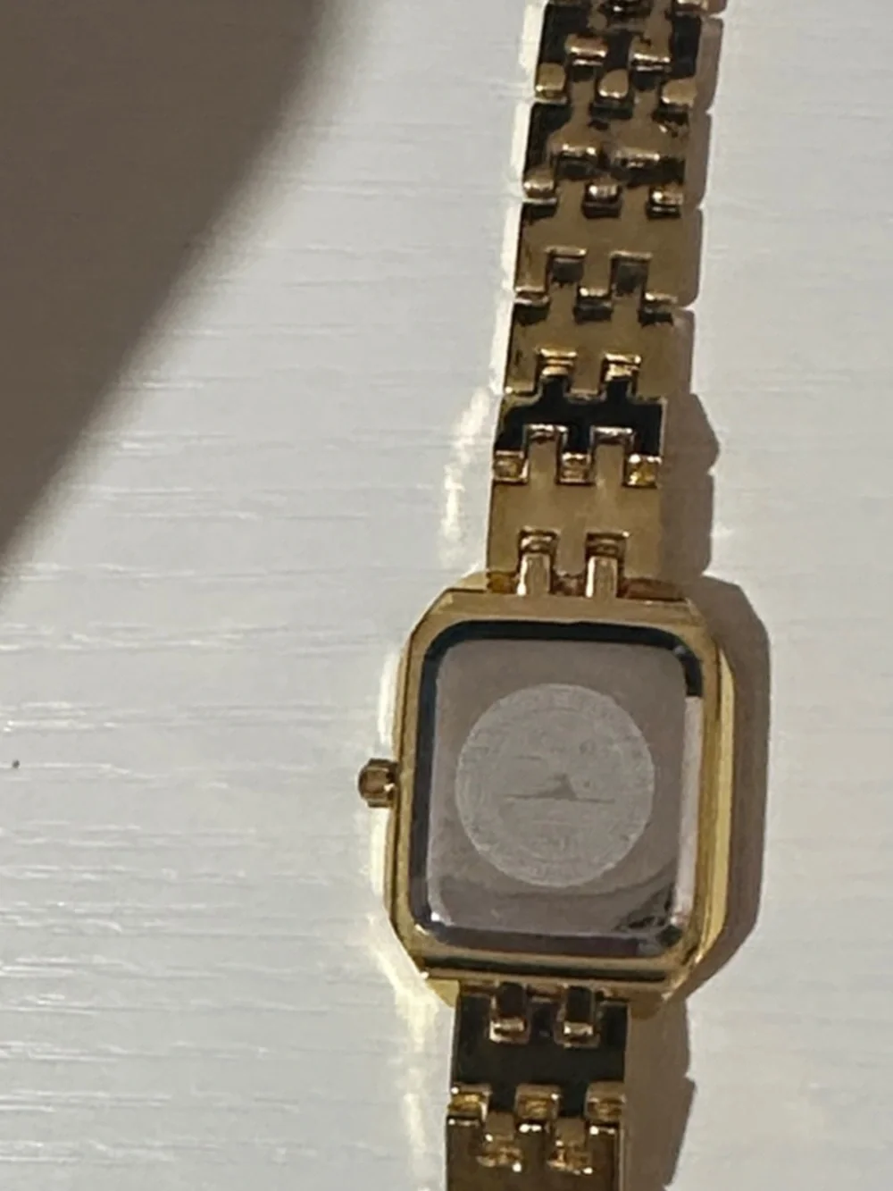 Elegant Gold-Tone Women's Crystal Bezel Watch with Blue Hands